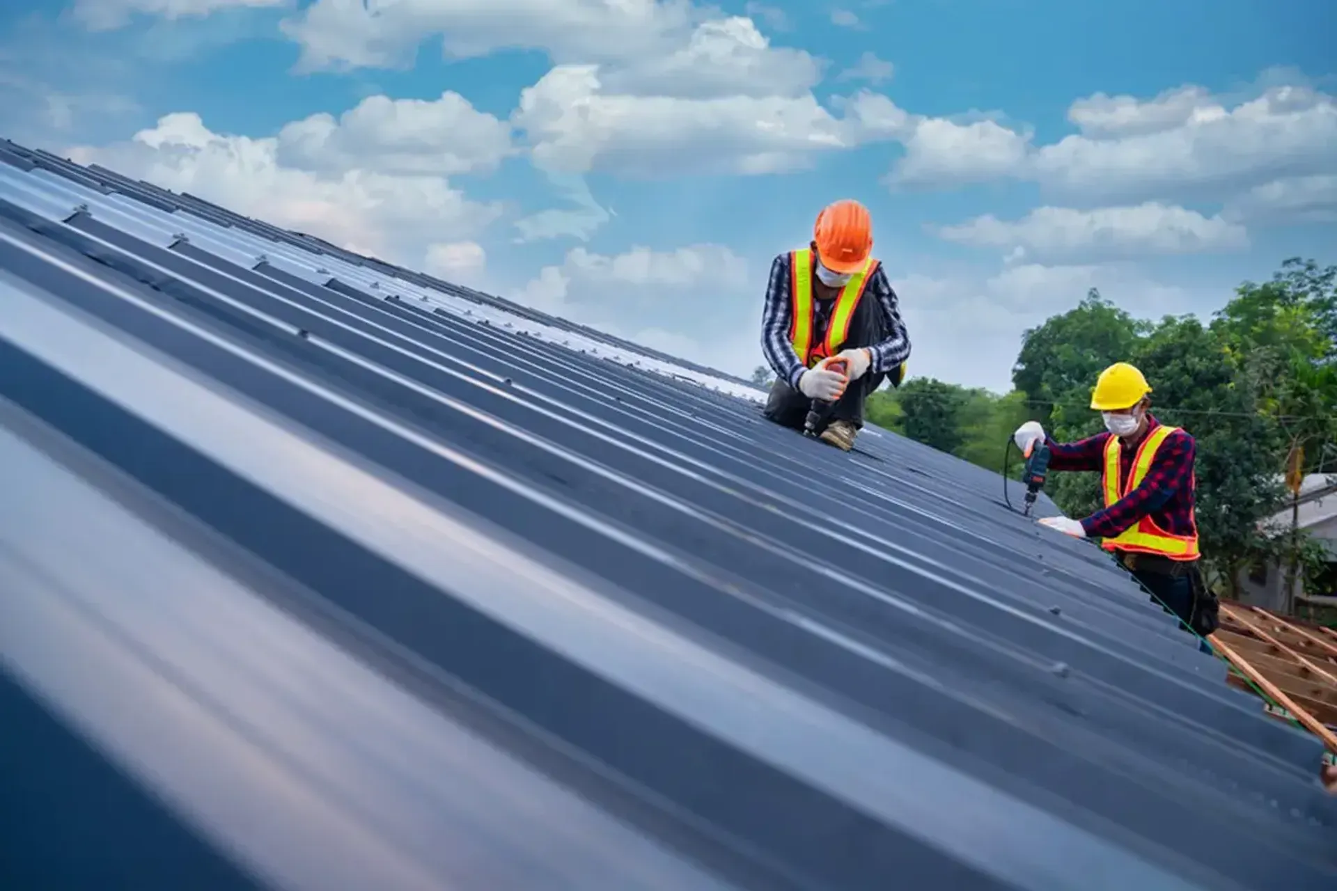 Roofing professional inspecting a roof